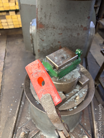 The blank is now orange hot and has an oval hole through it